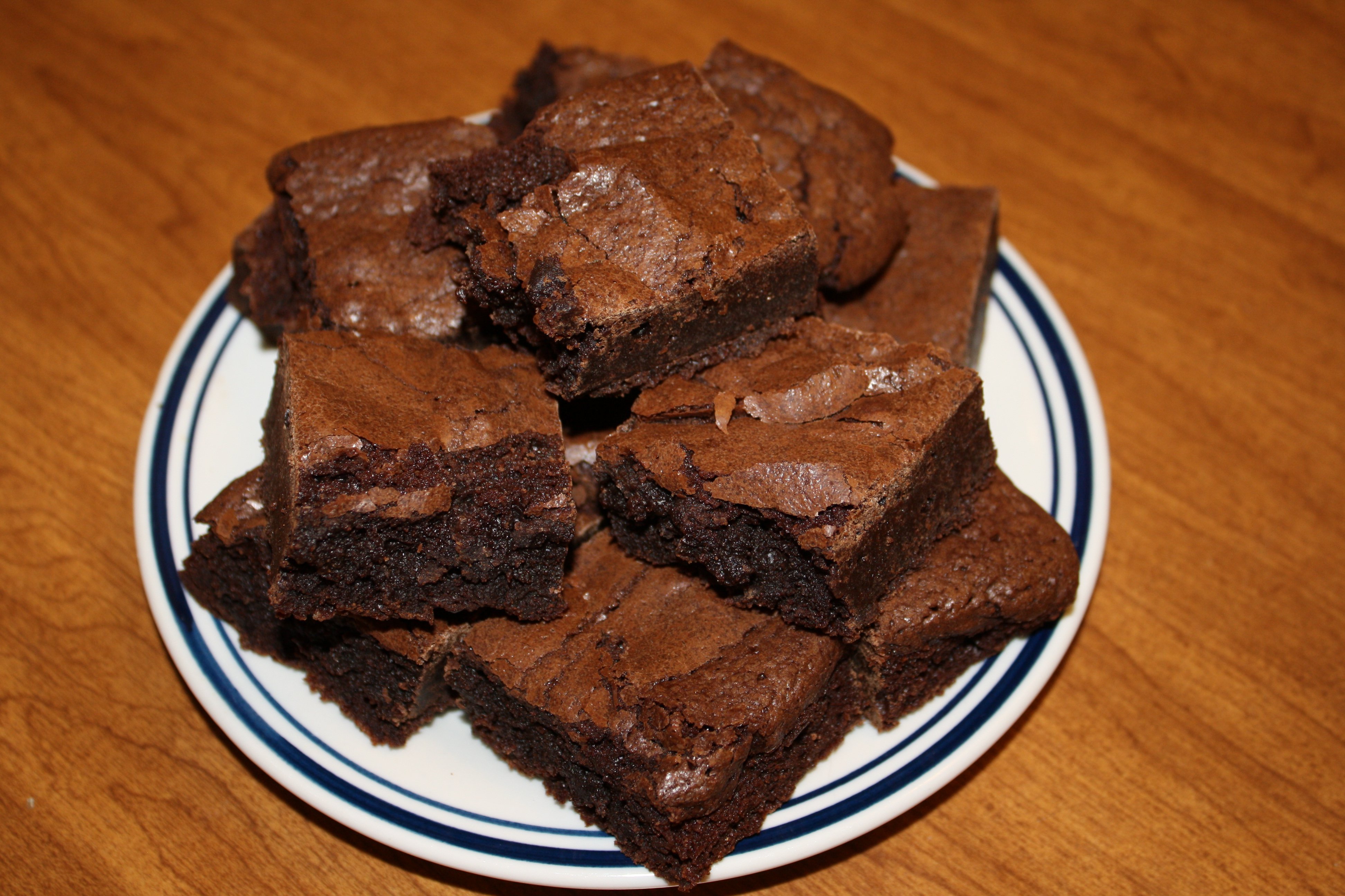 This is a plate of brownies. It's a very popular dessert and people really seem to enjoy it.
